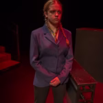 Sarah Genne acting in a dramatic scene on stage