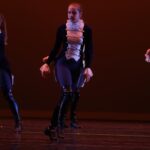 Sarah Genne dancing in a choreographed ensemble piece