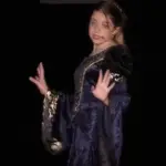 Sarah Genne performing a solo in a musical theatre production