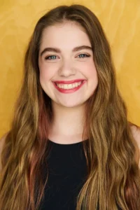 Teen actor, singer, and dancer, Sarah Genne, smiling in a headshot